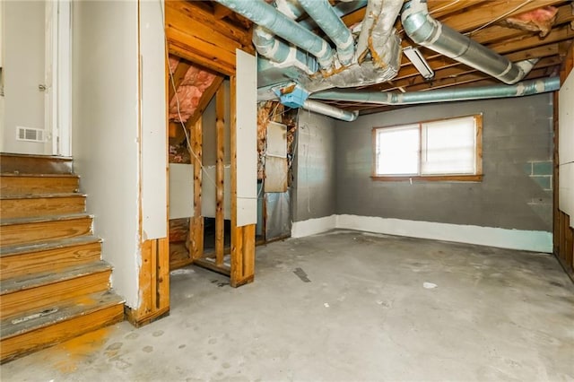 basement featuring visible vents and stairs