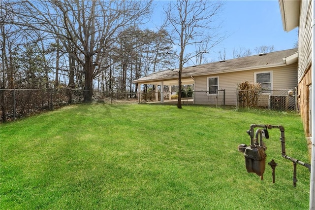 view of yard with a fenced backyard