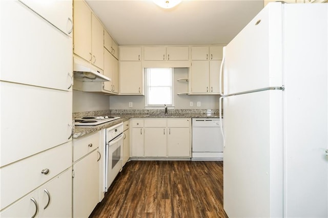 kitchen with under cabinet range hood, open shelves, a sink, dark wood finished floors, and white appliances