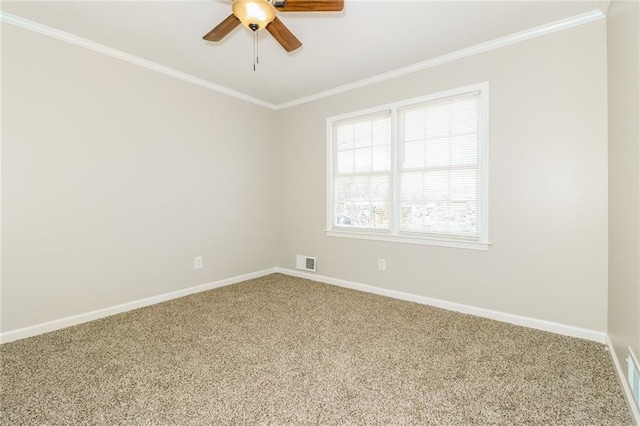 empty room featuring visible vents, crown molding, baseboards, carpet, and a ceiling fan