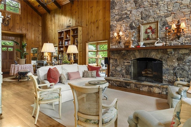 295 Goble Gap Ln, Clayton, GA 30525 - living room with wood finished floors, high vaulted ceiling, a wood ceiling with exposed beams, wooden walls, and a stone fireplace