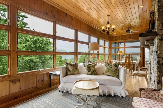 295 Goble Gap Ln, Clayton, GA 30525 - sunroom / solarium featuring wood ceiling, a chandelier, wood finished floors, wooden walls, and healthy amount of natural light