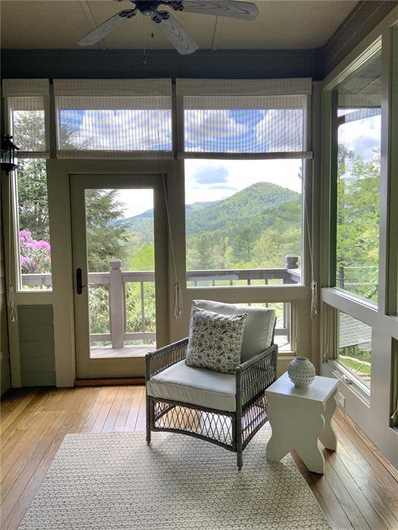 sunroom / solarium with a mountain view