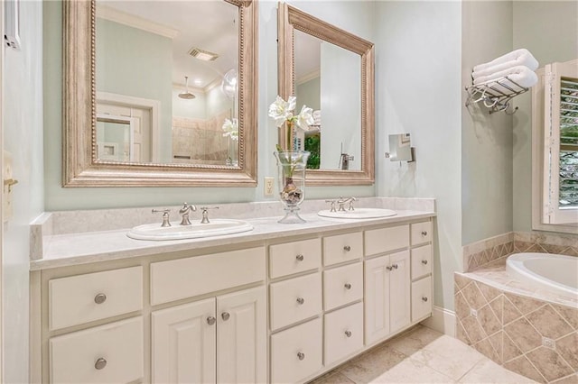 bathroom featuring double vanity, a bath, tile patterned floors, and tiled shower