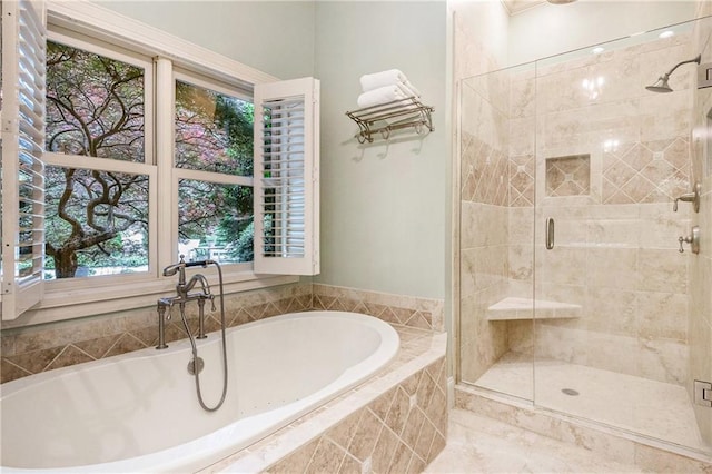 full bath with a garden tub, a stall shower, and plenty of natural light