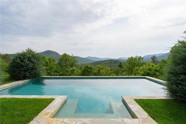 swimming pool featuring a mountain view