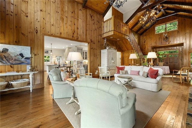 295 Goble Gap Ln, Clayton, GA 30525 - living area featuring wood walls, a chandelier, high vaulted ceiling, wood finished floors, and a wooden ceiling with exposed beams
