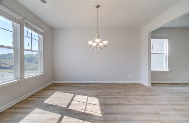 20 Fayme Ct, Newnan, GA 30263 - empty room with a chandelier, light wood-style floors, and baseboards
