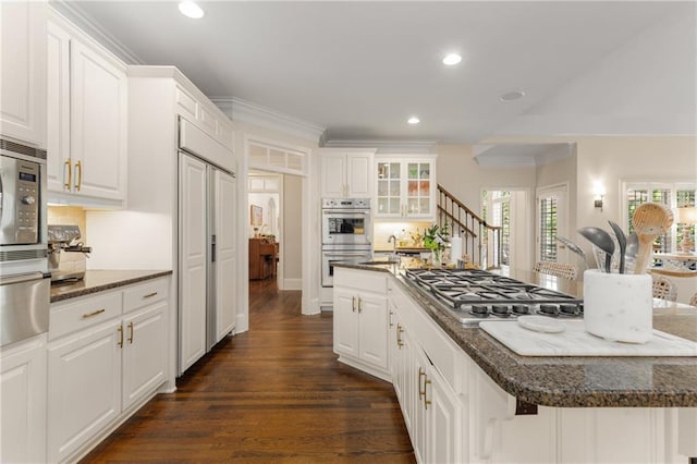 4789 Crest Park Ln, Marietta, GA 30068 - kitchen with stainless steel appliances, white cabinetry, recessed lighting, dark wood-style floors, and tasteful backsplash