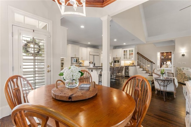 4789 Crest Park Ln, Marietta, GA 30068 - dining room with ornamental molding, stairs, ornate columns, dark wood-type flooring, and recessed lighting