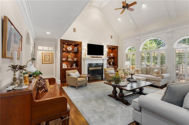 4789 Crest Park Ln, Marietta, GA 30068 - living area with high vaulted ceiling, wood finished floors, a ceiling fan, beamed ceiling, and a glass covered fireplace