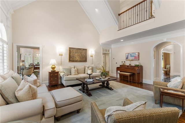 4789 Crest Park Ln, Marietta, GA 30068 - living room with arched walkways, high vaulted ceiling, wood finished floors, and ornamental molding