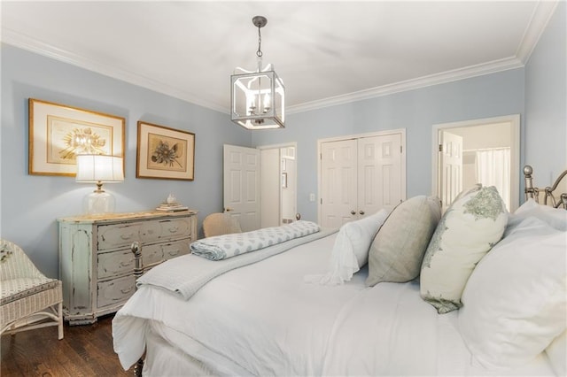 4789 Crest Park Ln, Marietta, GA 30068 - bedroom with a chandelier, crown molding, dark wood finished floors, and a closet