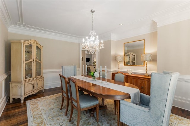 4789 Crest Park Ln, Marietta, GA 30068 - dining space featuring a chandelier, a wainscoted wall, crown molding, dark wood-style flooring, and a decorative wall