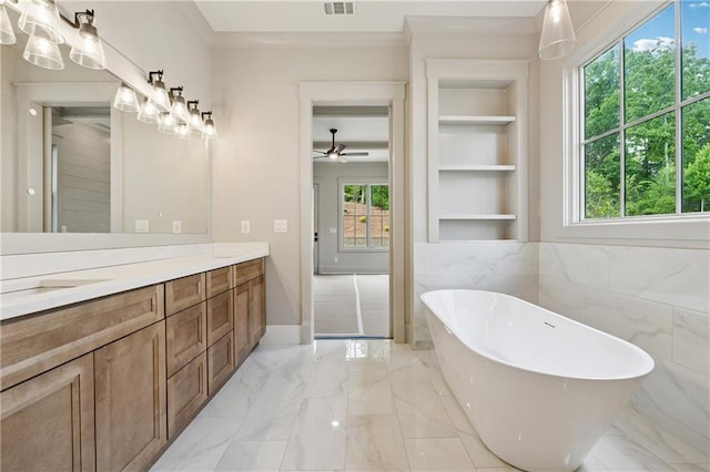 12 Night Fire Ct, Dawsonville, GA 30534 - full bathroom featuring a freestanding bath, marble tiled flooring, double vanity, built in shelves, and a ceiling fan