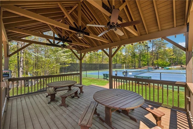 12 Night Fire Ct, Dawsonville, GA 30534 - deck with a tennis court, fence, view of wooded area, and ceiling fan