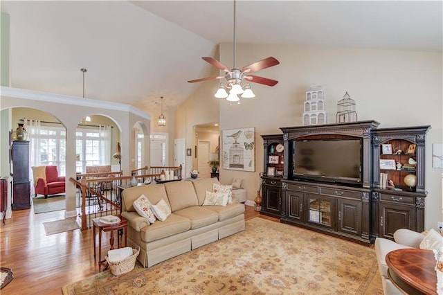 living room featuring light wood finished floors, ceiling fan, and high vaulted ceiling