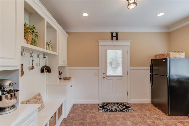 mudroom featuring a wainscoted wall, light tile patterned floors, ornamental molding, and recessed lighting