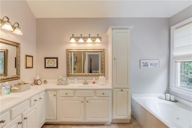 full bathroom featuring a bath, double vanity, and a sink