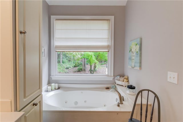 bathroom featuring a tub with jets