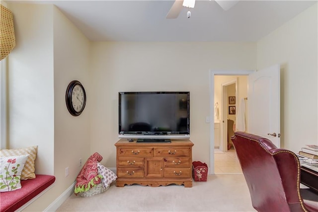 living room featuring ceiling fan and light carpet