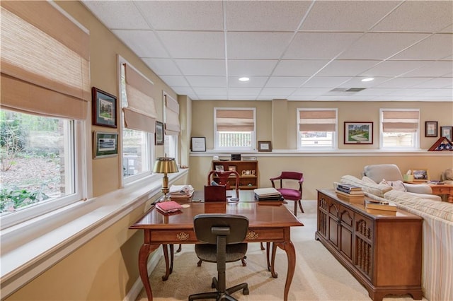 office area featuring visible vents, a wealth of natural light, and light colored carpet