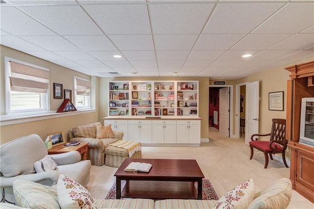 living room featuring light carpet and recessed lighting