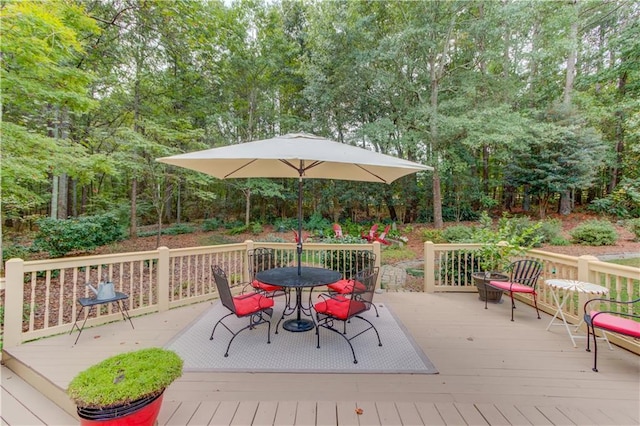 wooden deck featuring outdoor dining space