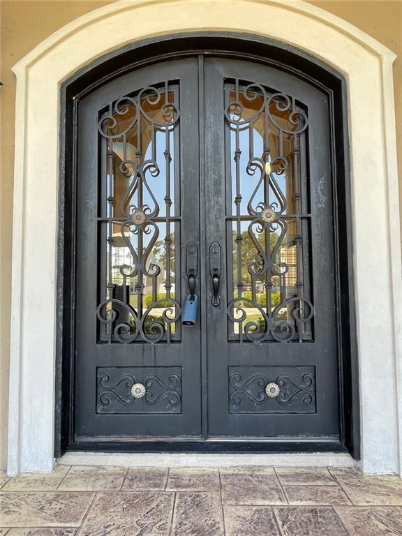 220 Pebble Beach Dr, Eufaula, AL 36027 - property entrance with a gate and stucco siding