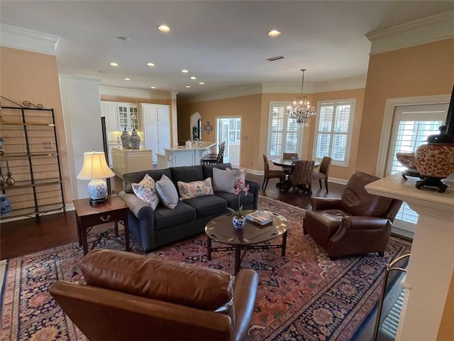 220 Pebble Beach Dr, Eufaula, AL 36027 - living area with crown molding, a chandelier, recessed lighting, baseboards, and dark wood-type flooring