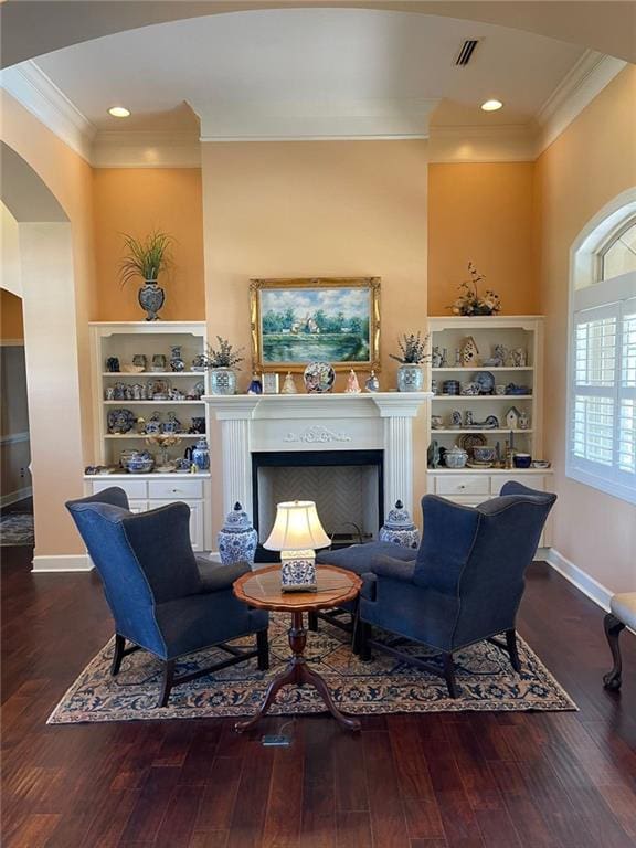 220 Pebble Beach Dr, Eufaula, AL 36027 - sitting room featuring ornamental molding, arched walkways, hardwood / wood-style floors, a fireplace, and baseboards