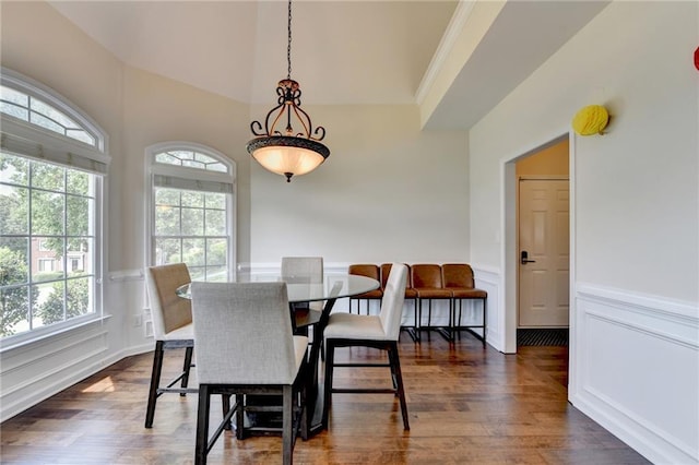 189 Azalea Chase Dr, Suwanee, GA 30024 - dining space featuring dark wood finished floors, a decorative wall, wainscoting, and crown molding