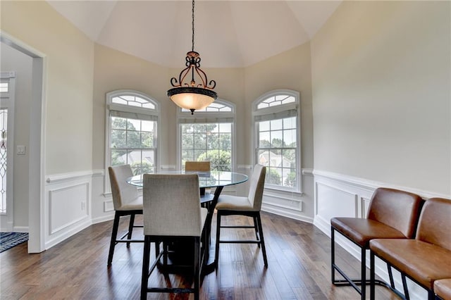 189 Azalea Chase Dr, Suwanee, GA 30024 - dining space with healthy amount of natural light, dark wood-style flooring, a decorative wall, a wainscoted wall, and vaulted ceiling