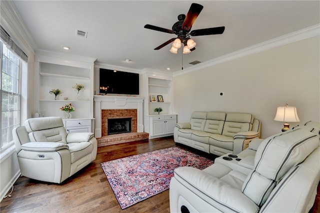 189 Azalea Chase Dr, Suwanee, GA 30024 - living room with healthy amount of natural light, ornamental molding, wood finished floors, a ceiling fan, and recessed lighting
