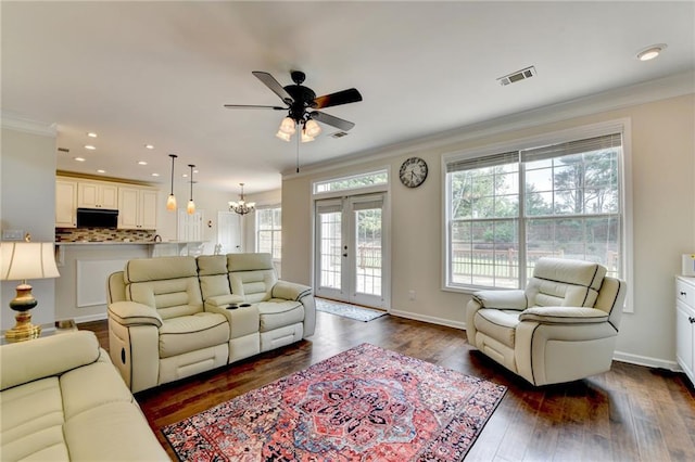 189 Azalea Chase Dr, Suwanee, GA 30024 - living area with ornamental molding, a ceiling fan, dark wood finished floors, recessed lighting, and a chandelier