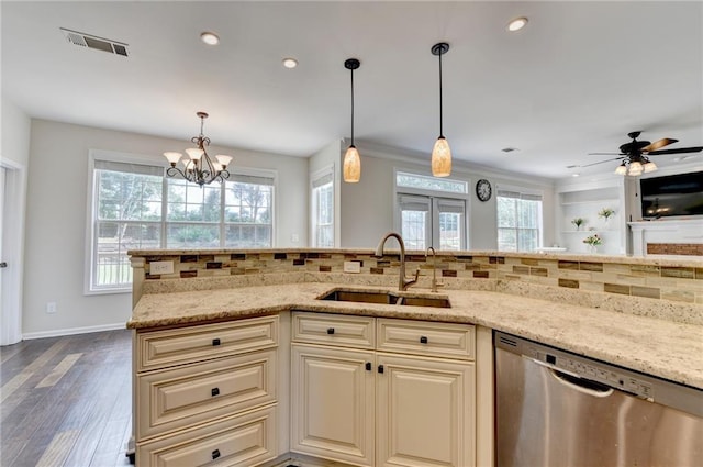 189 Azalea Chase Dr, Suwanee, GA 30024 - kitchen with stainless steel dishwasher, light stone counters, tasteful backsplash, dark wood-style flooring, and pendant lighting