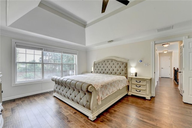 189 Azalea Chase Dr, Suwanee, GA 30024 - bedroom with ornamental molding, dark wood-style flooring, a tray ceiling, and ceiling fan