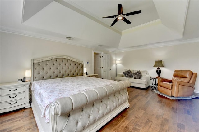 189 Azalea Chase Dr, Suwanee, GA 30024 - bedroom featuring a tray ceiling, crown molding, dark wood-style flooring, and ceiling fan