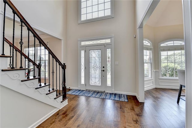 189 Azalea Chase Dr, Suwanee, GA 30024 - foyer entrance with a towering ceiling, hardwood / wood-style flooring, and stairway
