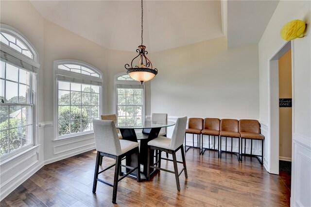 189 Azalea Chase Dr, Suwanee, GA 30024 - dining space with dark wood-style flooring and vaulted ceiling