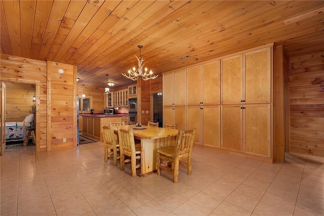 dining space featuring light tile patterned flooring, an inviting chandelier, wooden walls, and wood ceiling