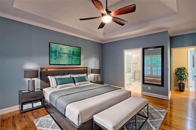 521 Crabapple Rd, Clarkesville, GA 30523 - bedroom featuring a raised ceiling, baseboards, wood finished floors, and ornamental molding