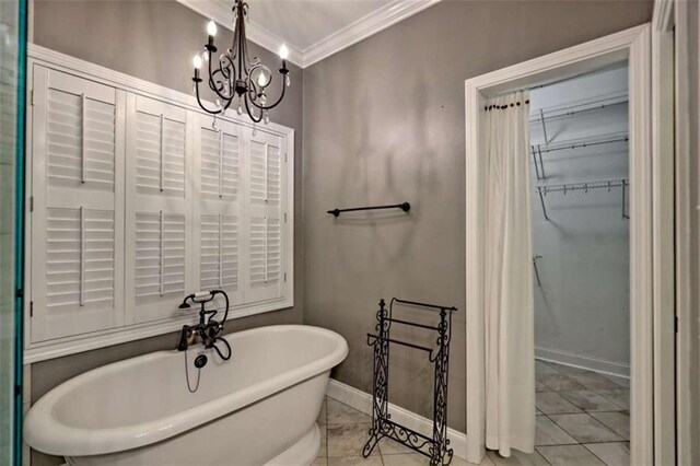 521 Crabapple Rd, Clarkesville, GA 30523 - full bathroom with ornamental molding, a soaking tub, a chandelier, baseboards, and a walk in closet