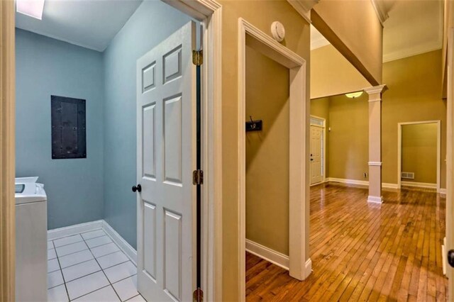 521 Crabapple Rd, Clarkesville, GA 30523 - hallway with electric panel, ornate columns, baseboards, hardwood / wood-style flooring, and washing machine and dryer