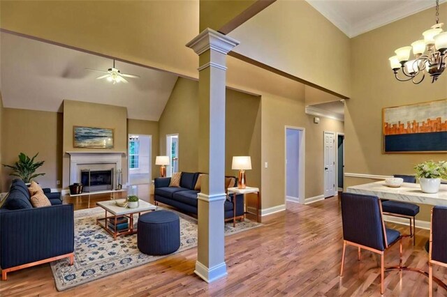 521 Crabapple Rd, Clarkesville, GA 30523 - living room featuring a high ceiling, wood finished floors, baseboards, a chandelier, and a ceiling fan