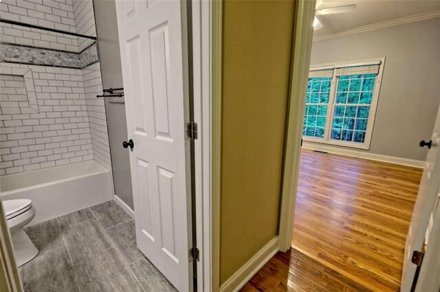 521 Crabapple Rd, Clarkesville, GA 30523 - full bathroom featuring ornamental molding, toilet, baseboards, shower / bathtub combination, and wood finished floors