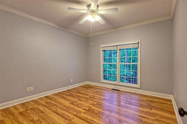 521 Crabapple Rd, Clarkesville, GA 30523 - empty room featuring baseboards, wood finished floors, a ceiling fan, and ornamental molding
