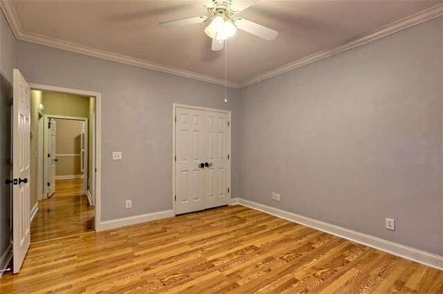 521 Crabapple Rd, Clarkesville, GA 30523 - unfurnished bedroom with light wood-style flooring, crown molding, and baseboards