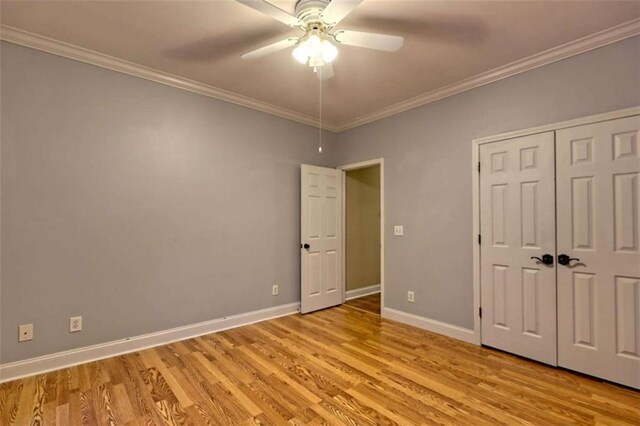 521 Crabapple Rd, Clarkesville, GA 30523 - unfurnished bedroom with light wood-style flooring, ornamental molding, baseboards, a ceiling fan, and a closet