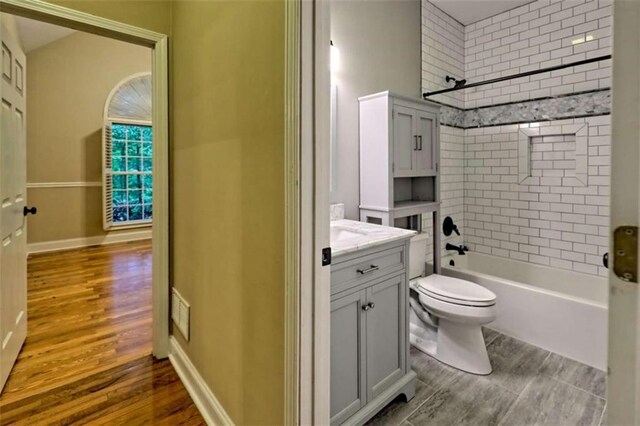 521 Crabapple Rd, Clarkesville, GA 30523 - full bathroom with vanity, shower / bath combination, wood finished floors, and toilet